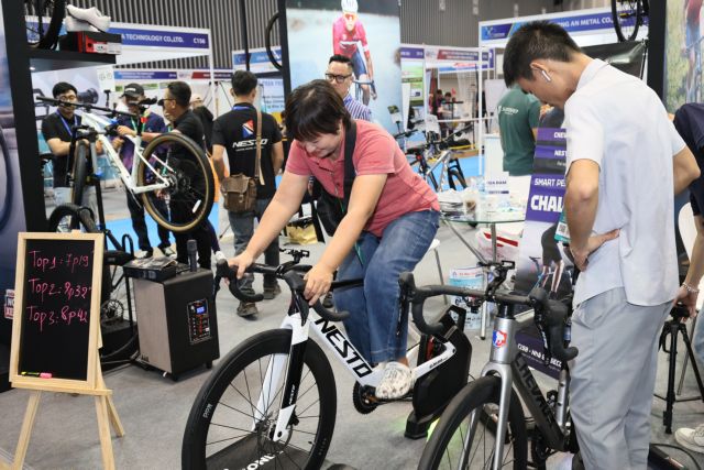 A visitor testing a sports product at Vietnam Sport Show 2025 in Ho Chi Minh City