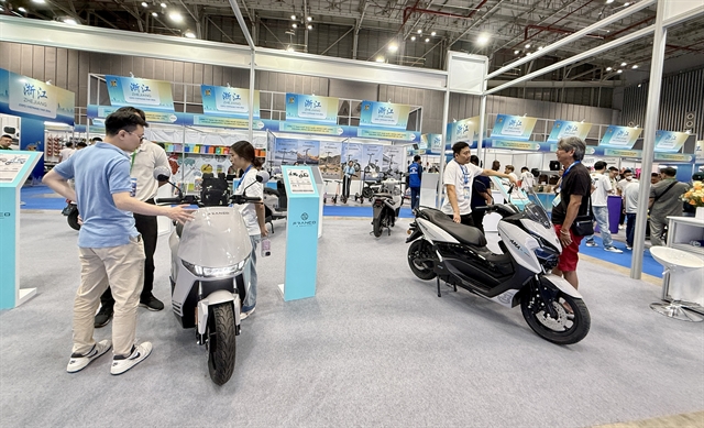 Visitors looking at bicycles and electric bikes at Vietnam Cycle Expo 2026 at SECC, Ho Chi Minh City