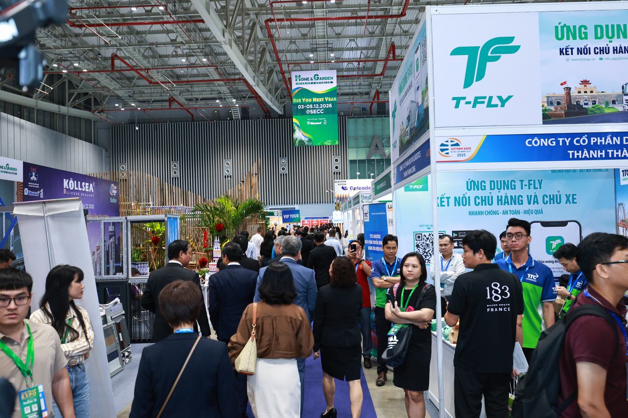 Exhibitors and visitors at a booth during the Vietnam Home and Garden Expo 2025 in Ho Chi Minh City