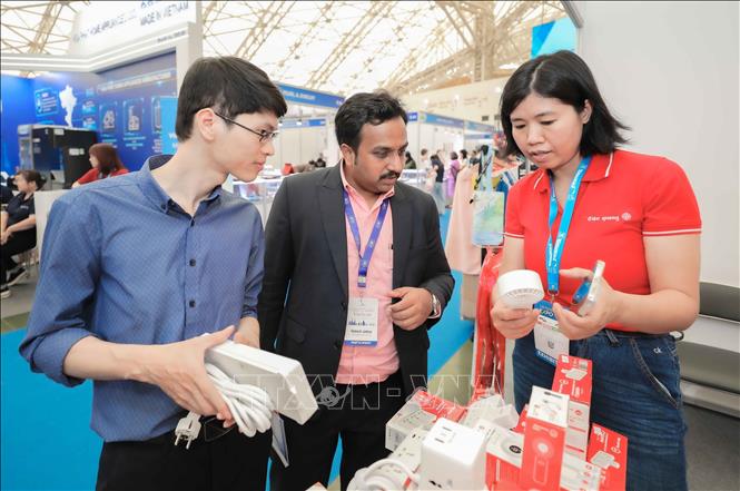 Visitors at booths during Vietnam Expo 2026 at the Vietnam Exhibition Center, Hanoi