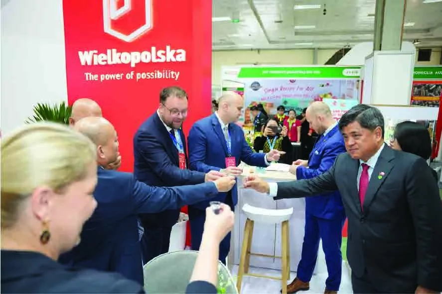 Wielkopolska Poland pavilion at Vietfood Hanoi 2025 with officials tasting products